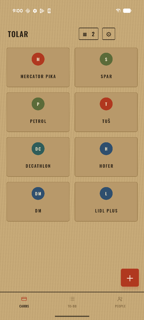 The Tolar card grid showing eight loyalty cards, each with a coloured monogram disc.
